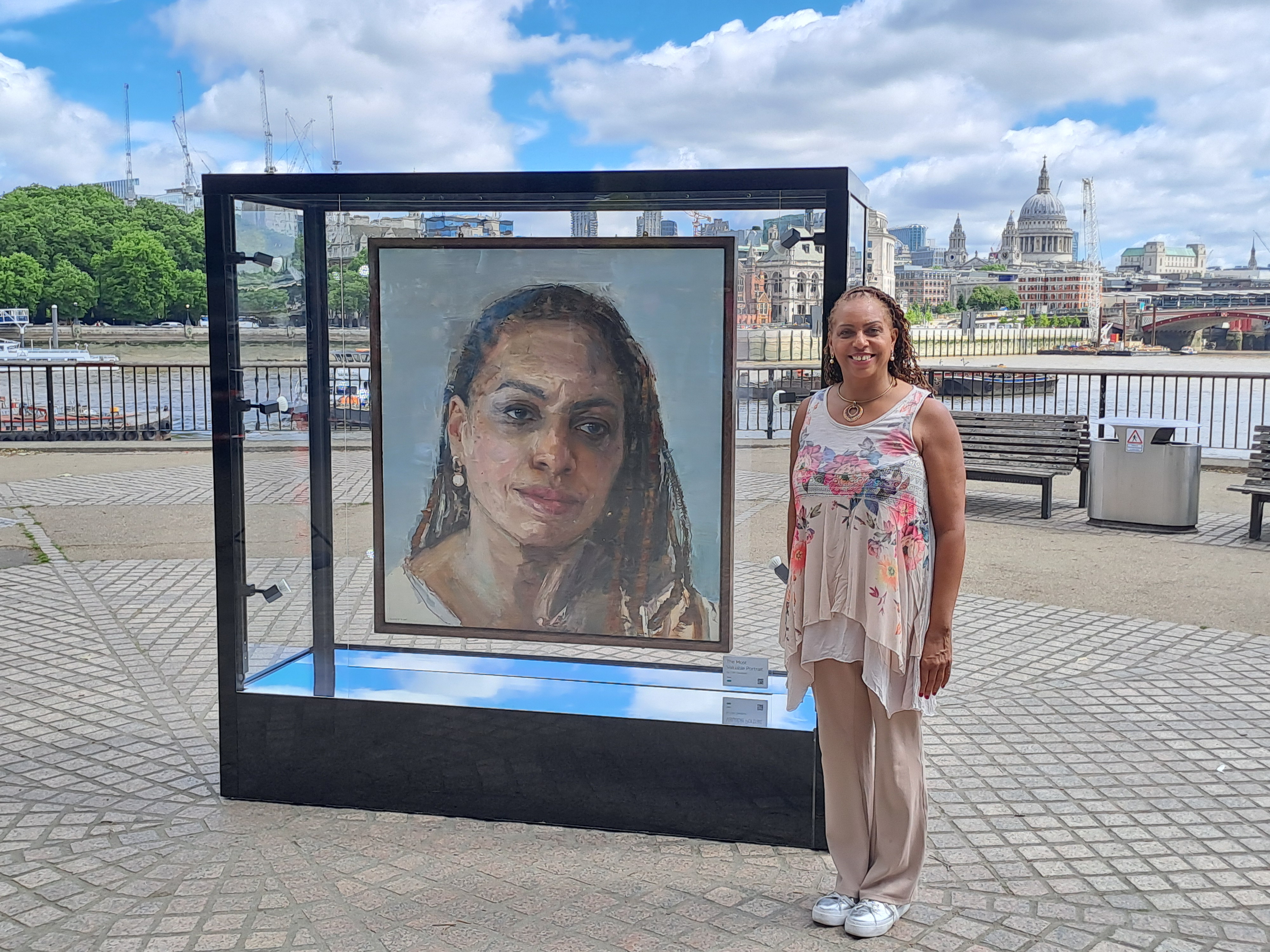 Jaycee with her portrait on London's South Bank.