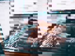 Close up of a man using a computer A close up of a male hands using a computer