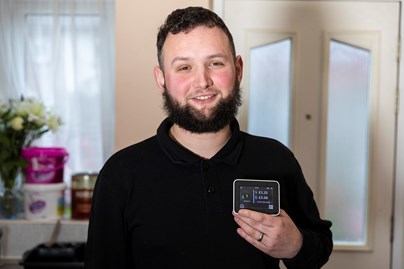 Joe holding smart meter display