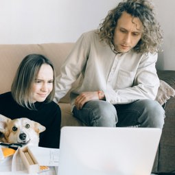 two women looking at computer at home