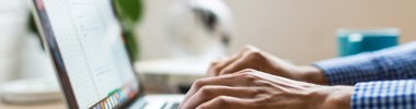 close up of a person using a laptop