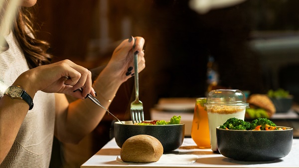 close up woman eating salad