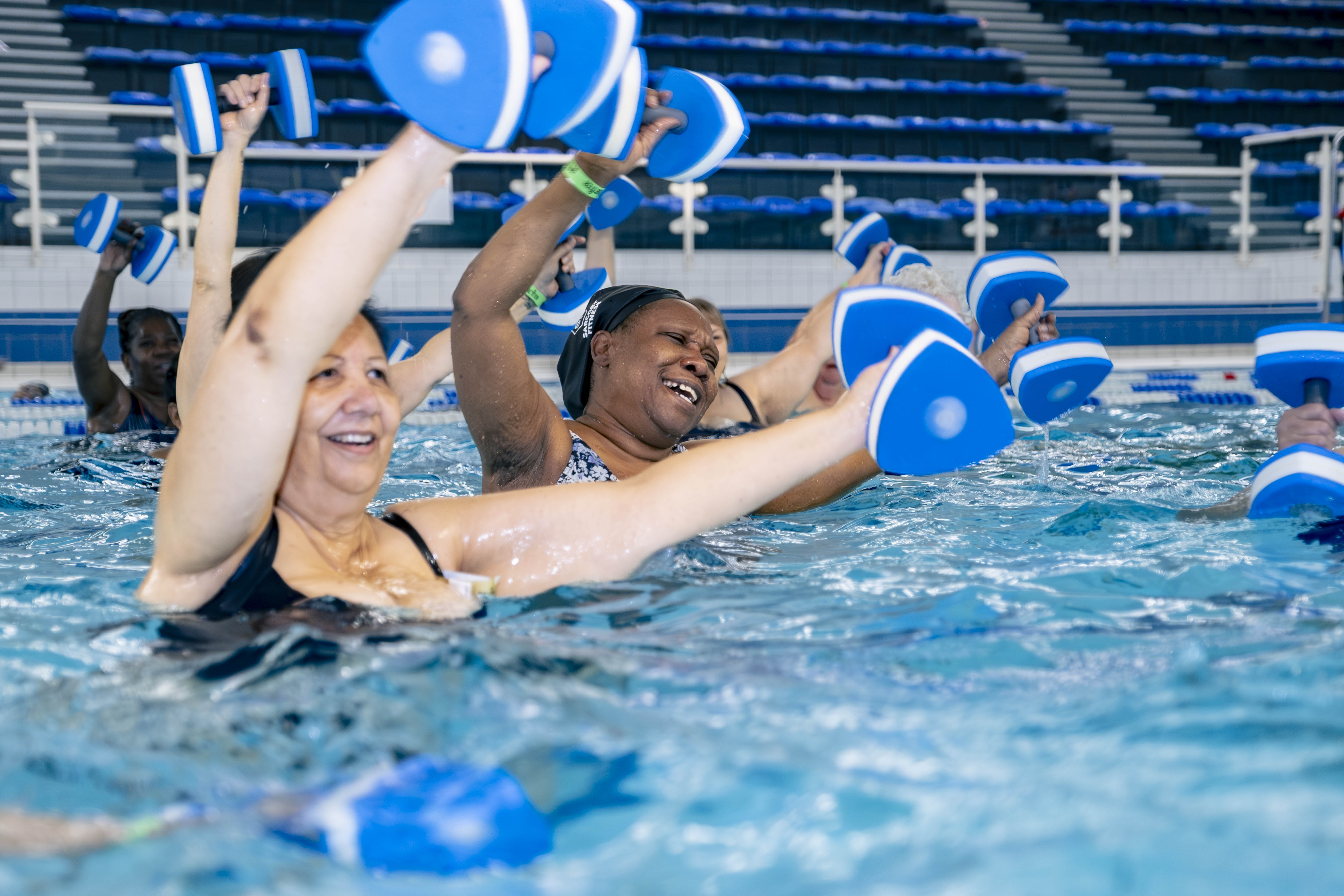 Women doing aerobics in a pool