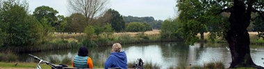two people outdoors with bikes