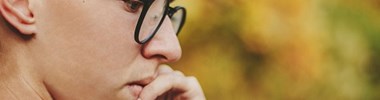 boy with glasses thinking