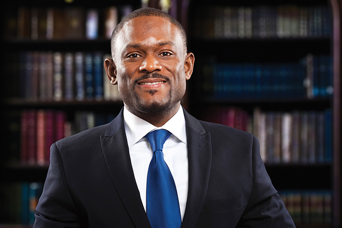 smiling man wearing a suit