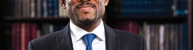 smiling man wearing a suit